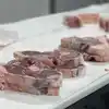 A few stacks of leg of lamb steaks.